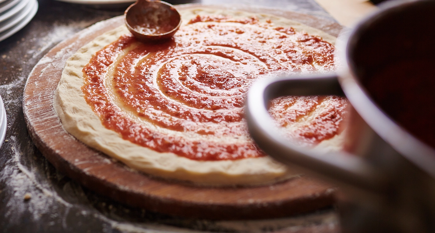 Bar Pizza Being Made